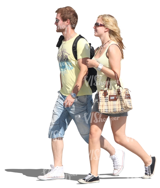 couple walking hand in hand in summertime