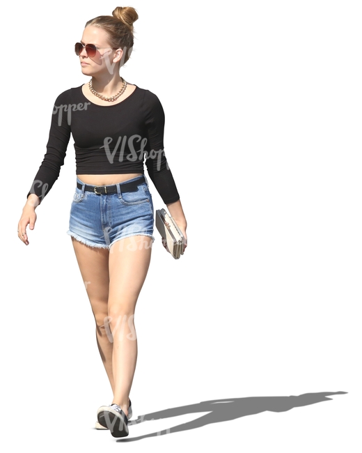 woman in denim shorts walking