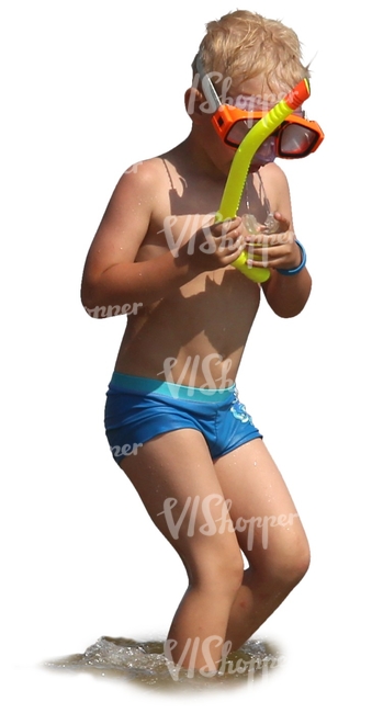 boy with a snorkeling mask standing in the water