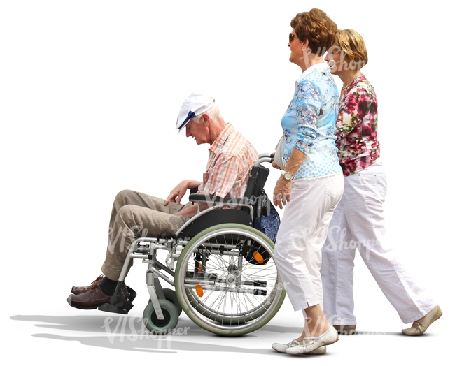 two women pushing a man in a wheelchair