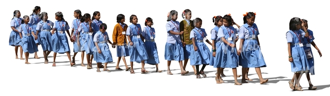 group of indian schoolgirls walking in a row