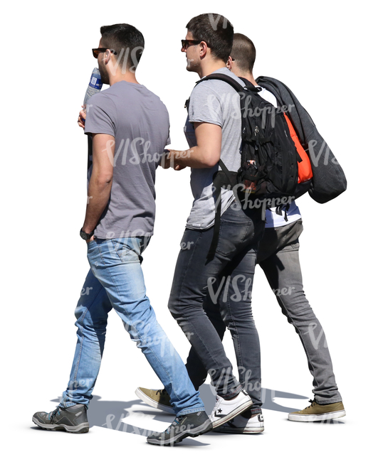 three young men walking on the street