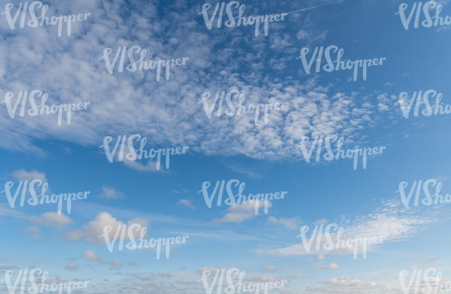 blue sky with thin line of clouds