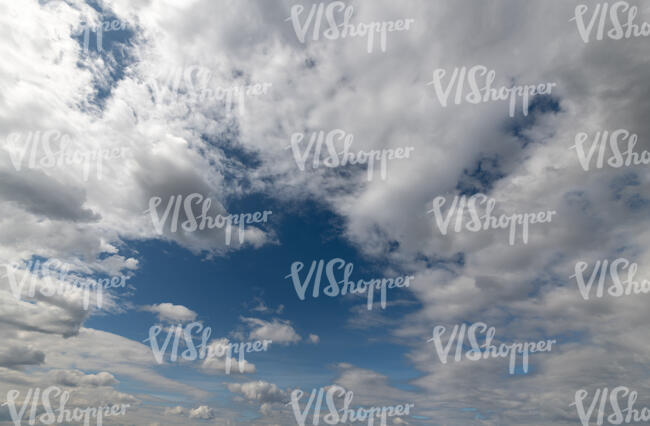 cloudy sky with one clear spot