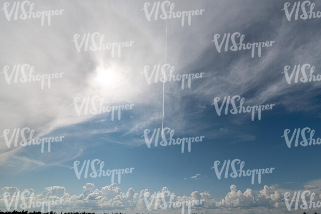 daytime sky with large white cloud