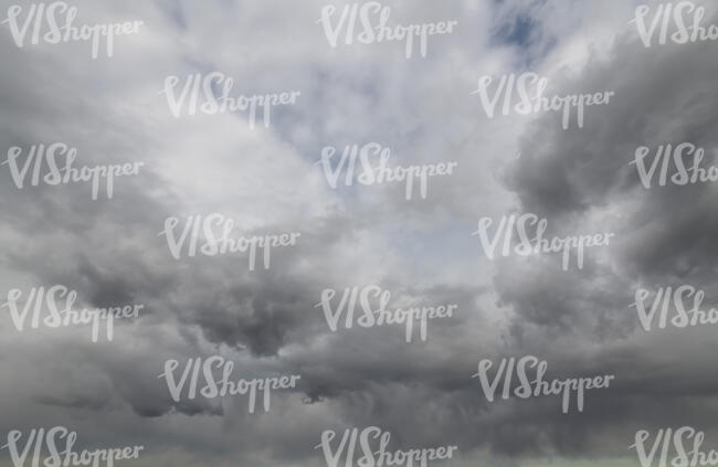 sky covered with fluffy grey clouds