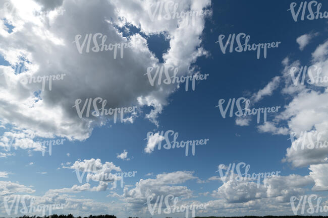 blue sky with large white clouds