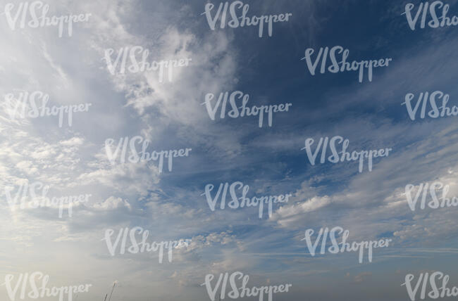 deep blue sky with thin clouds