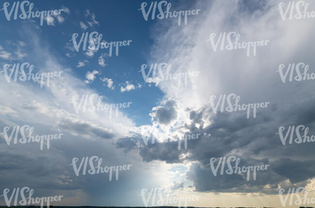 evening sky with large white clouds