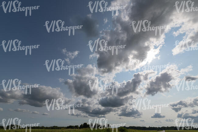 sky with sun behind clouds