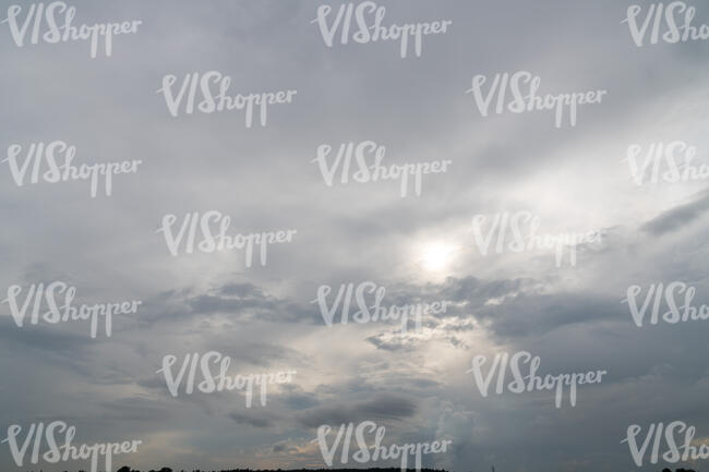 evening sky with sun and hazy clouds