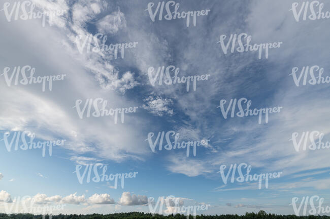 blue sky with large cirrus clouds