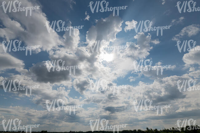 cloudy daytime sky with sun partly visible