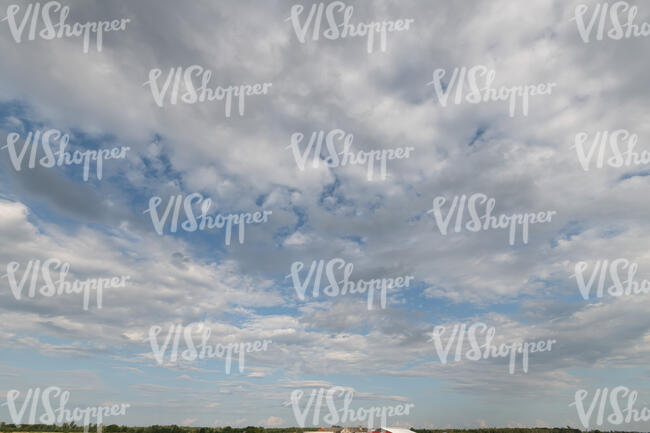 sky almost covered with white clouds