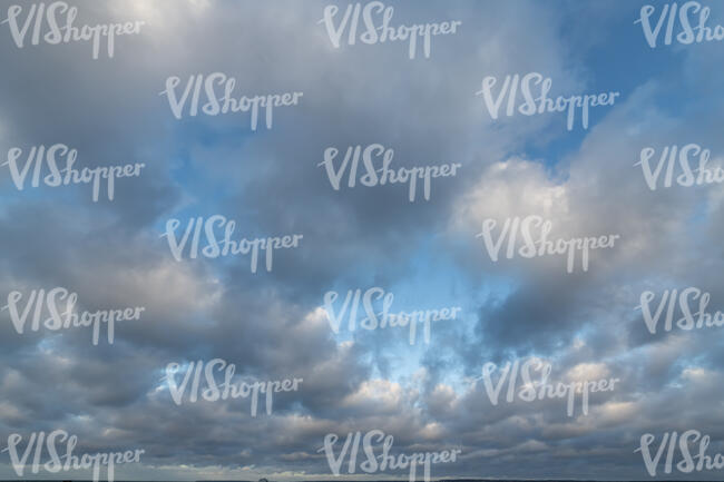 sky filled with grey cumulus clouds